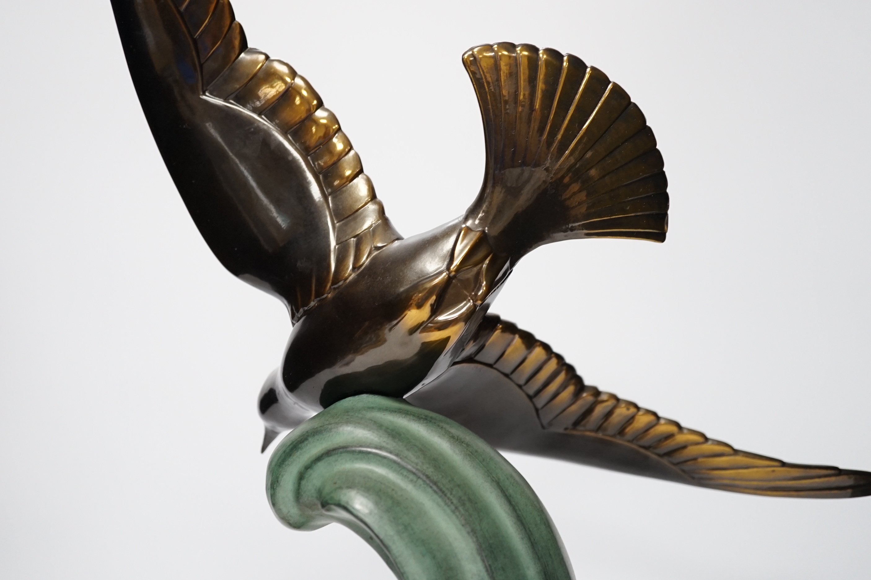 A French Art Deco bronzed and patinated metal Seagull on marble base, 51cm high